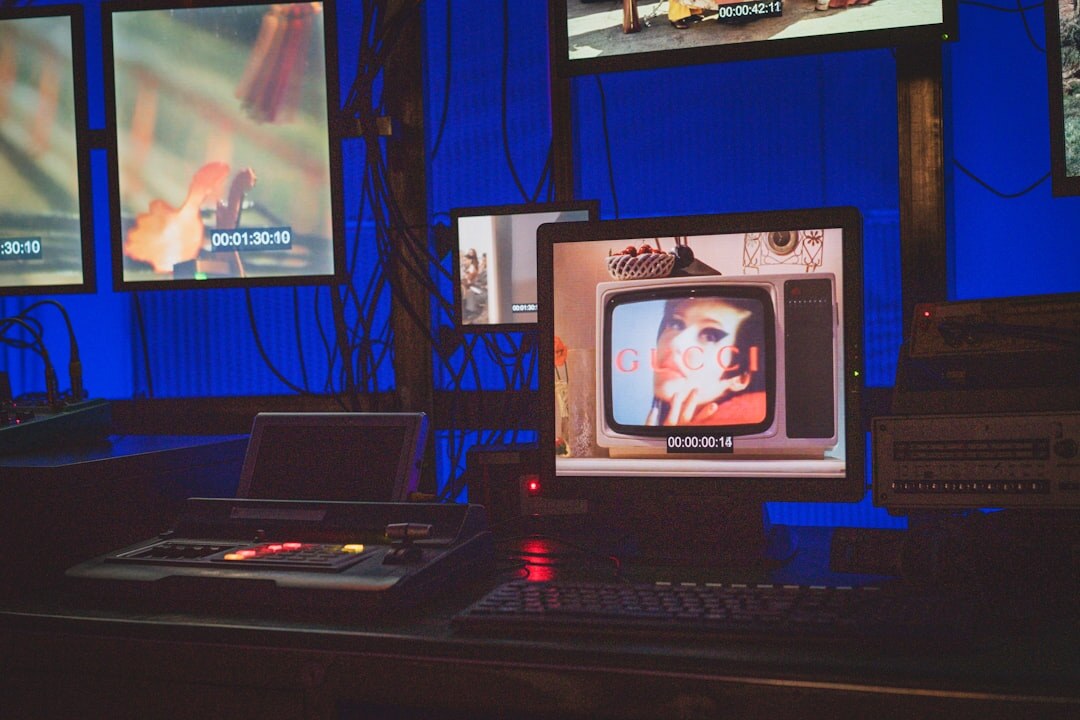 Live broadcast control room with video switcher and multiple monitors