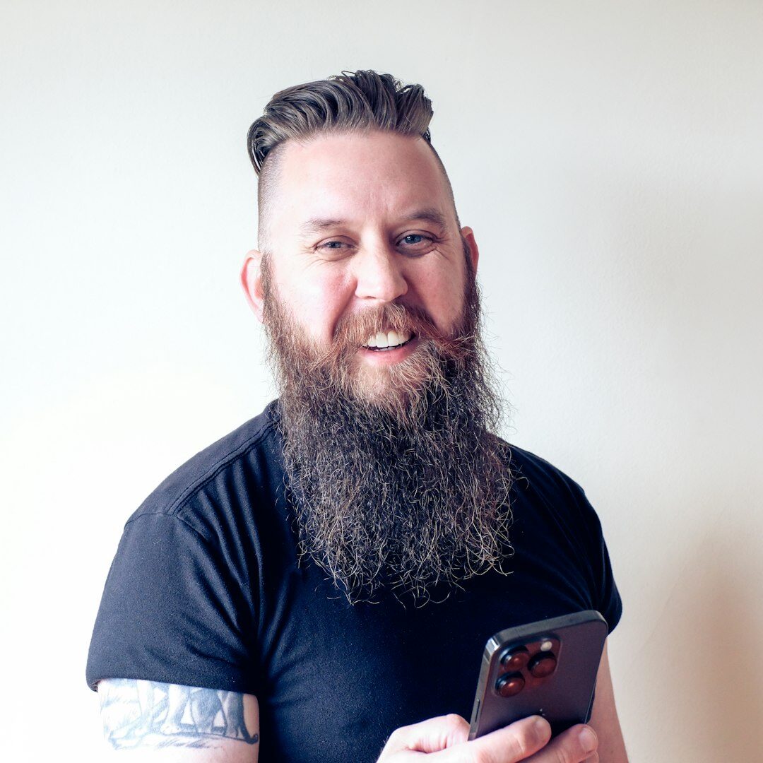 Portrait of a Finnish male broadcast trainer with short hair and beard
