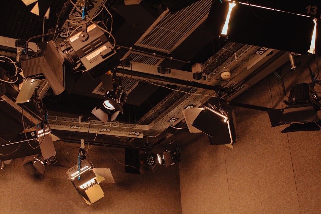 Studio lighting rig above a television set